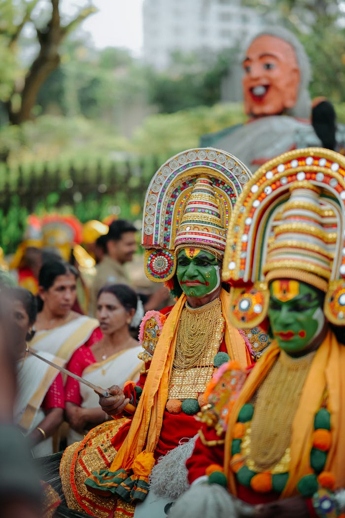 Colorful Kathakali dancers performing at a vibrant cultural festival with an enthusiastic crowd.